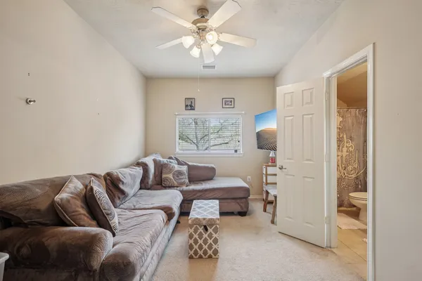 a living room with furniture and a large window