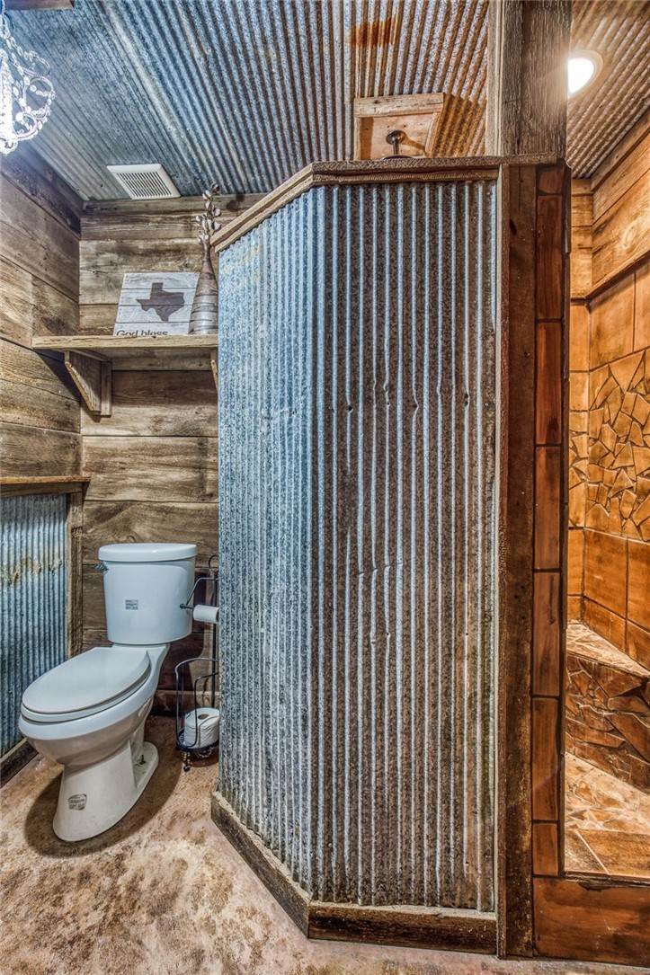 7300-2 Goehring Road Ledbetter, TX 78946 - Photo 9 of 21 a bathroom with a toilet and a shower curtain