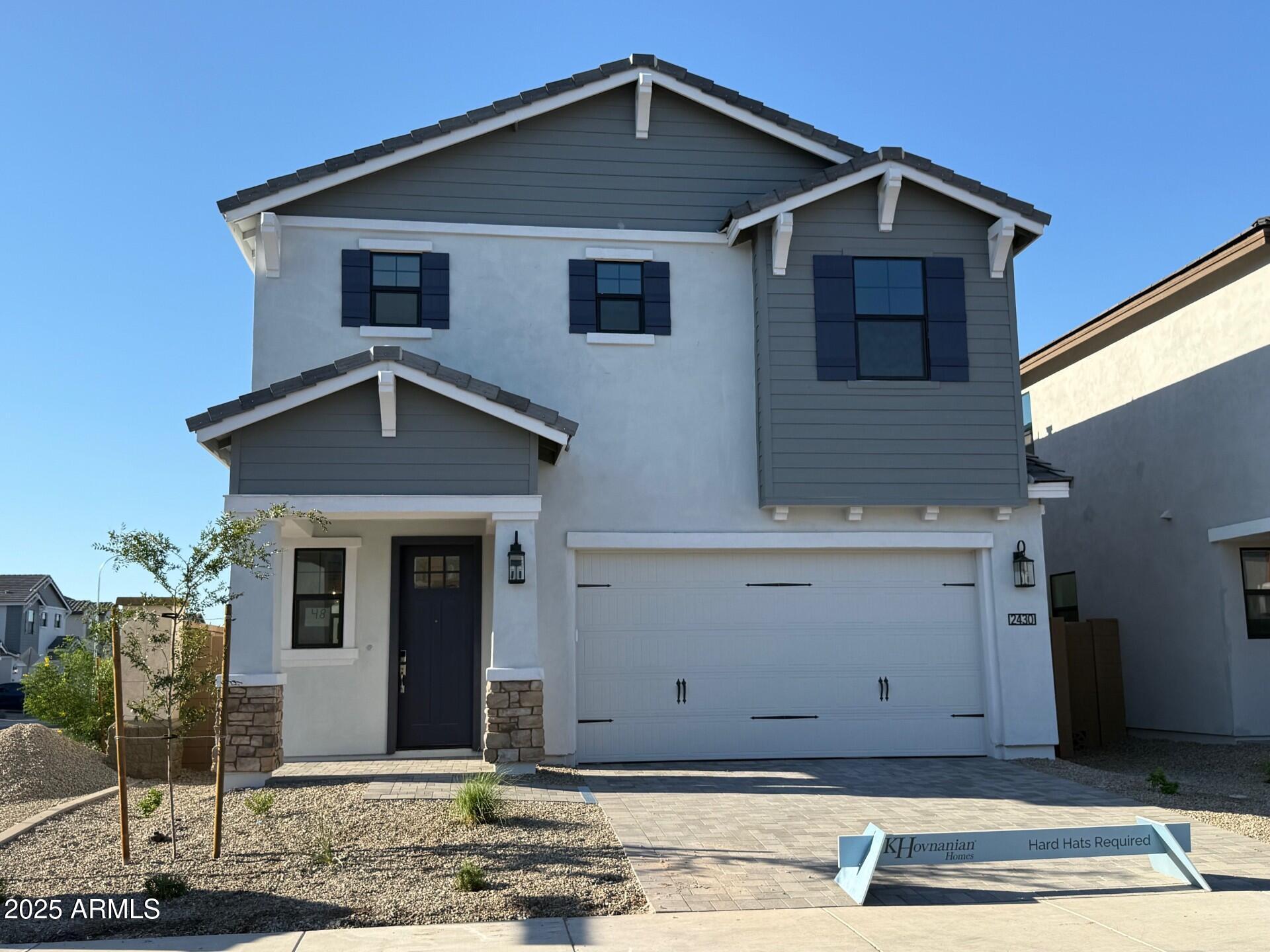 2430 West Los Arboles Place Chandler, AZ 85224 - Photo 1 of 41 a front view of a house with garden