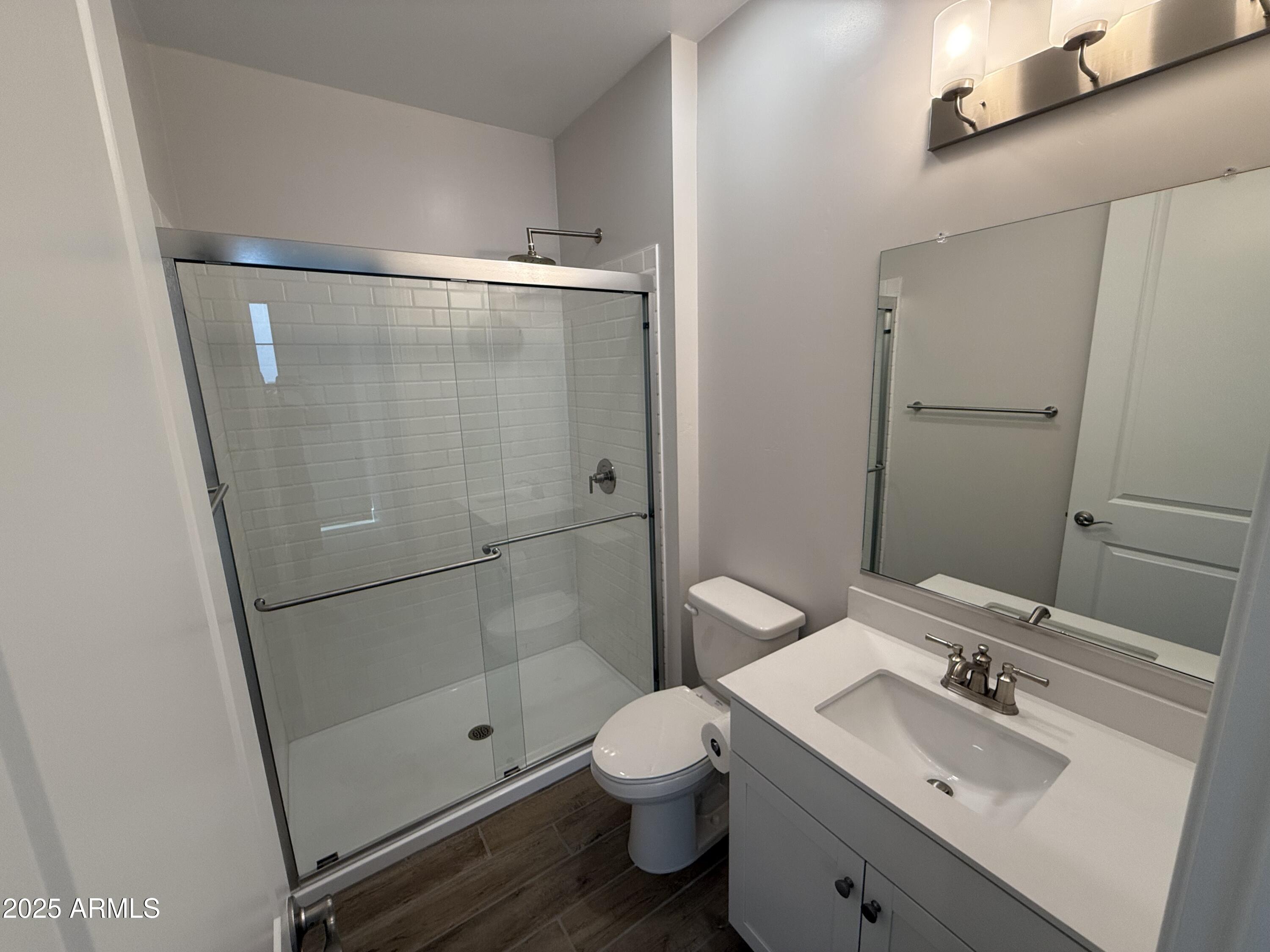 2430 West Los Arboles Place Chandler, AZ 85224 - Photo 17 of 41 a bathroom with a sink a toilet and shower