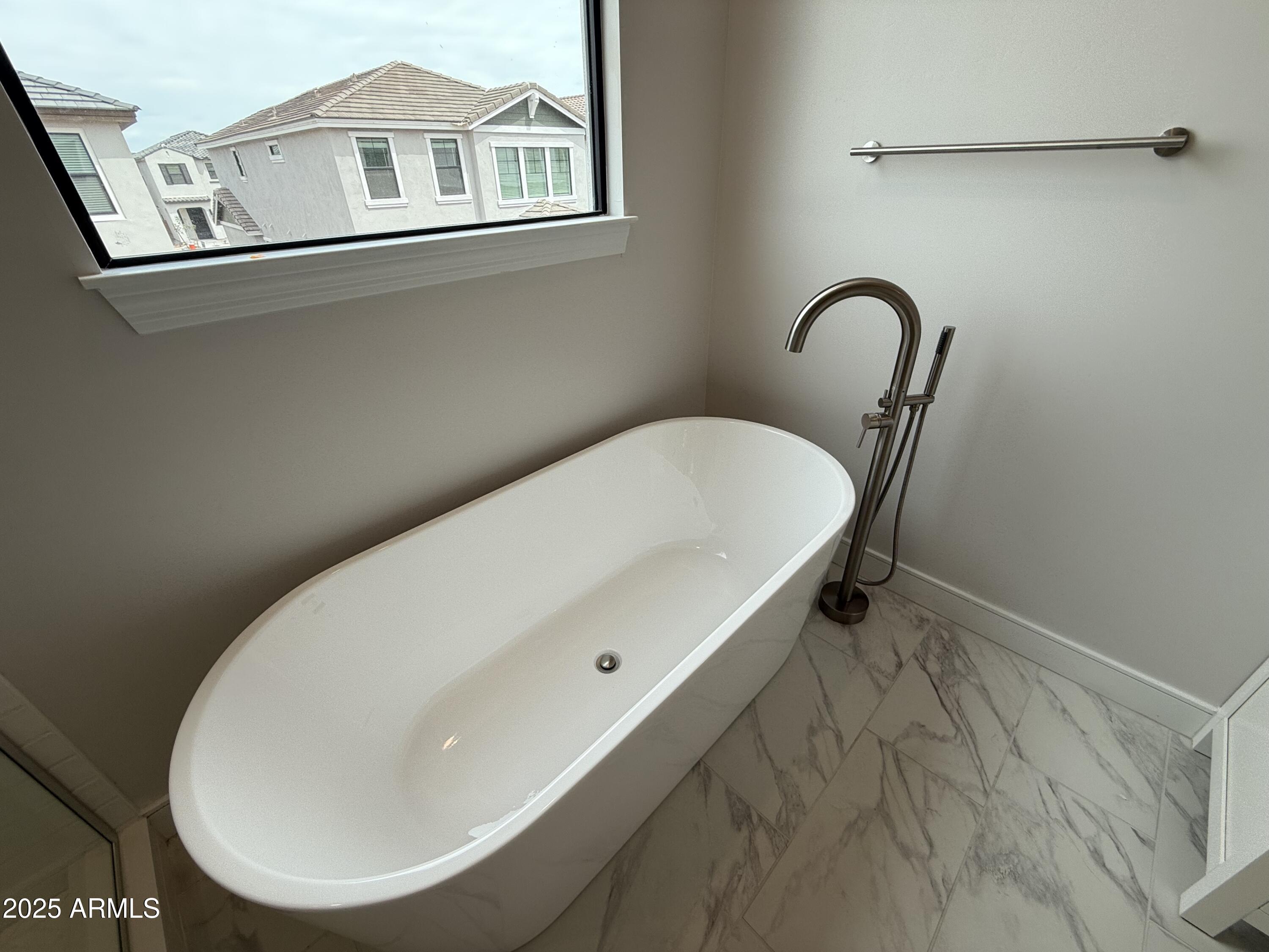 2430 West Los Arboles Place Chandler, AZ 85224 - Photo 27 of 41 a bathroom with a sink and a mirror