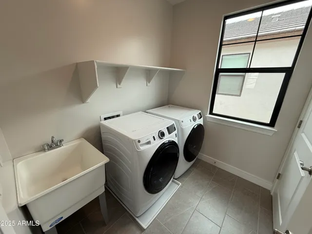 a utility room with dryer and washer