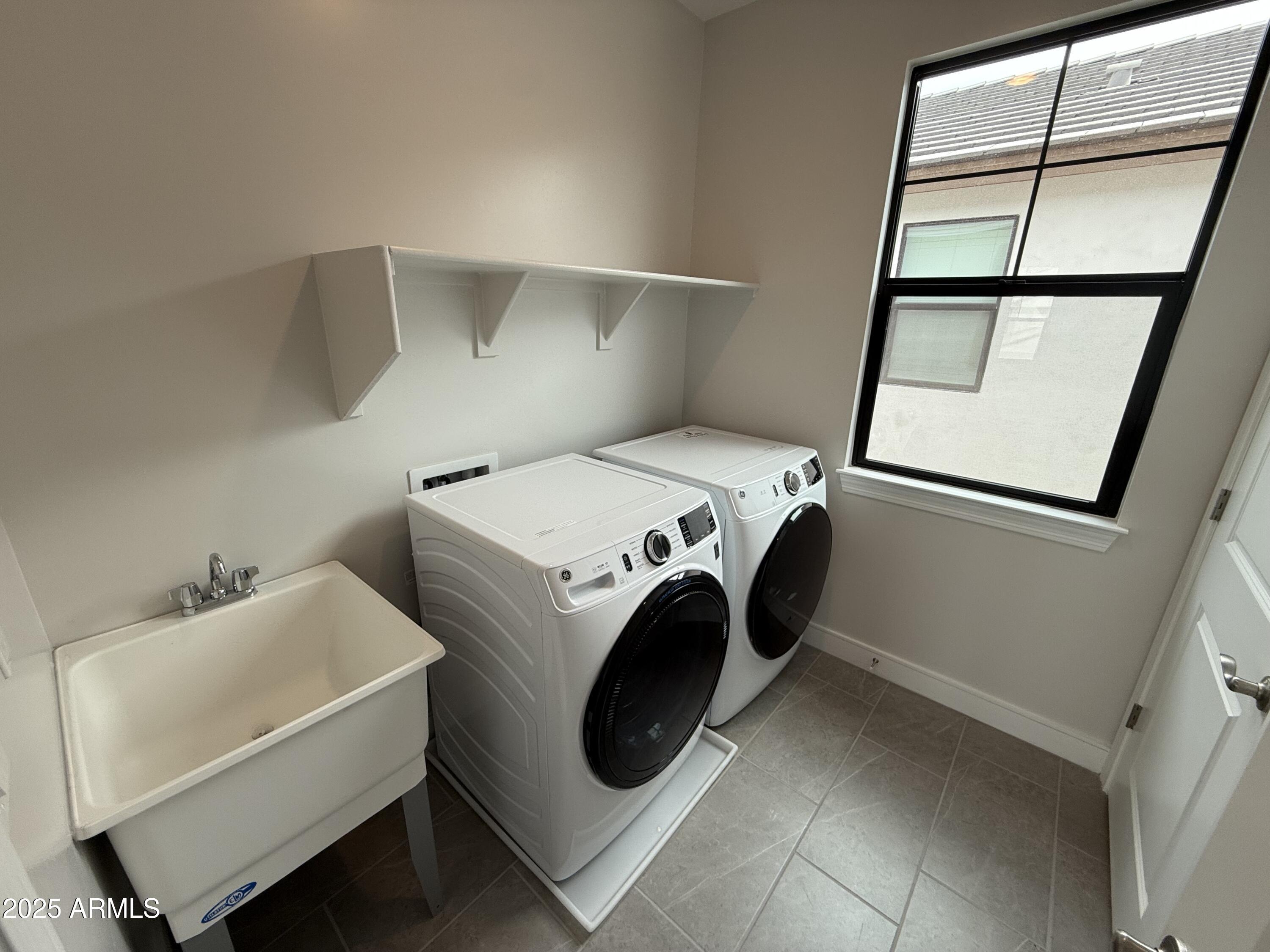 2430 West Los Arboles Place Chandler, AZ 85224 - Photo 29 of 41 a utility room with dryer and washer