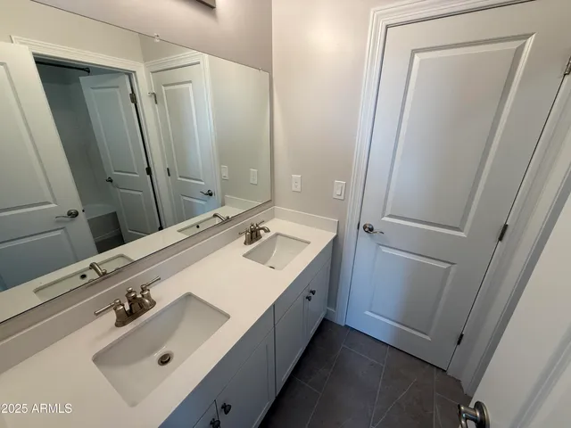 a white toilet and tub next to a window
