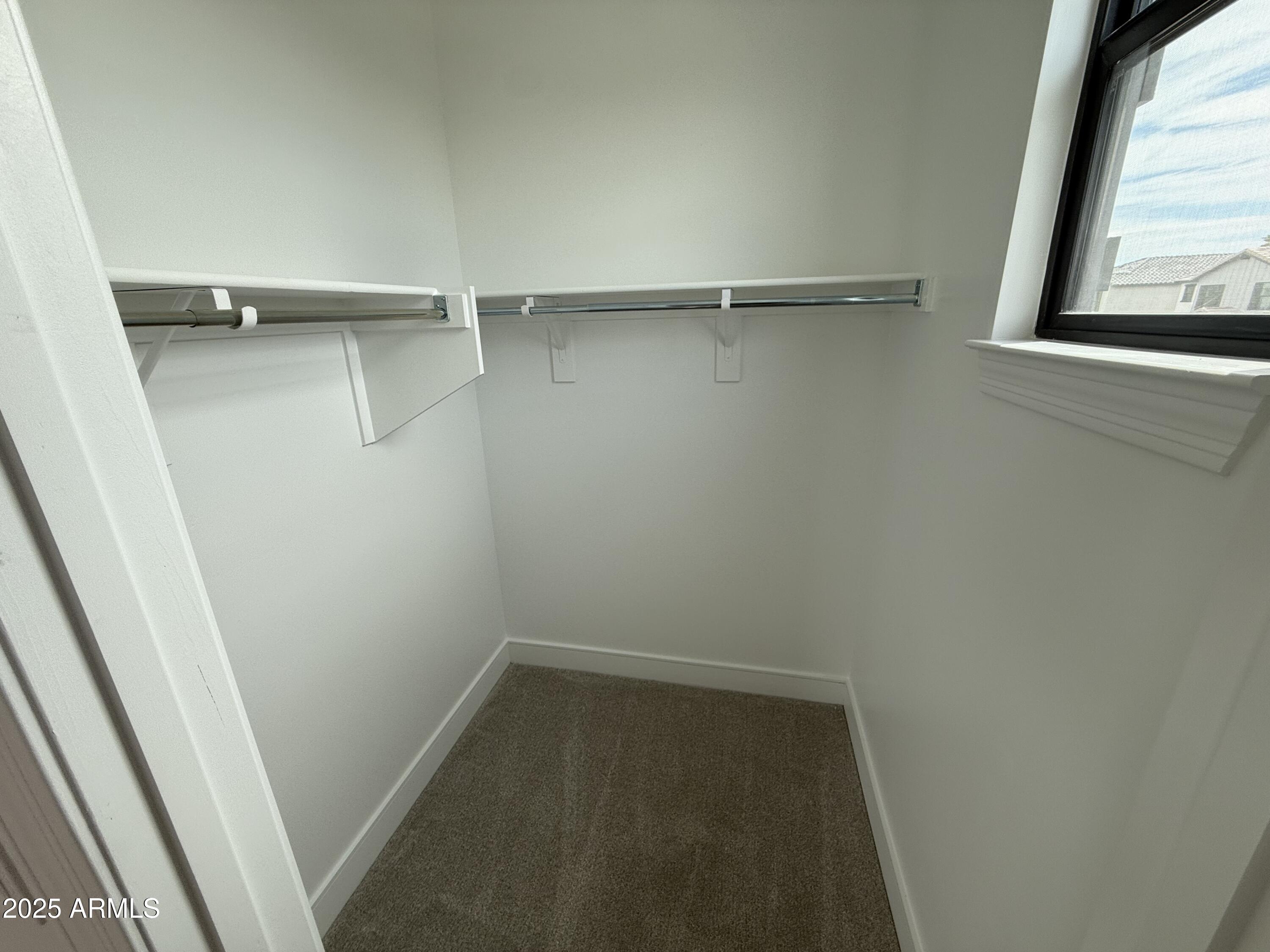 2430 West Los Arboles Place Chandler, AZ 85224 - Photo 39 of 41 a view of a room with rack on the wall