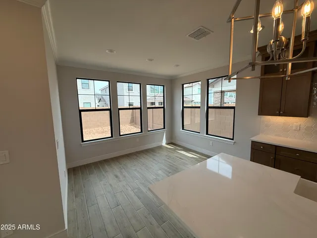 a view of kitchen with wooden floor