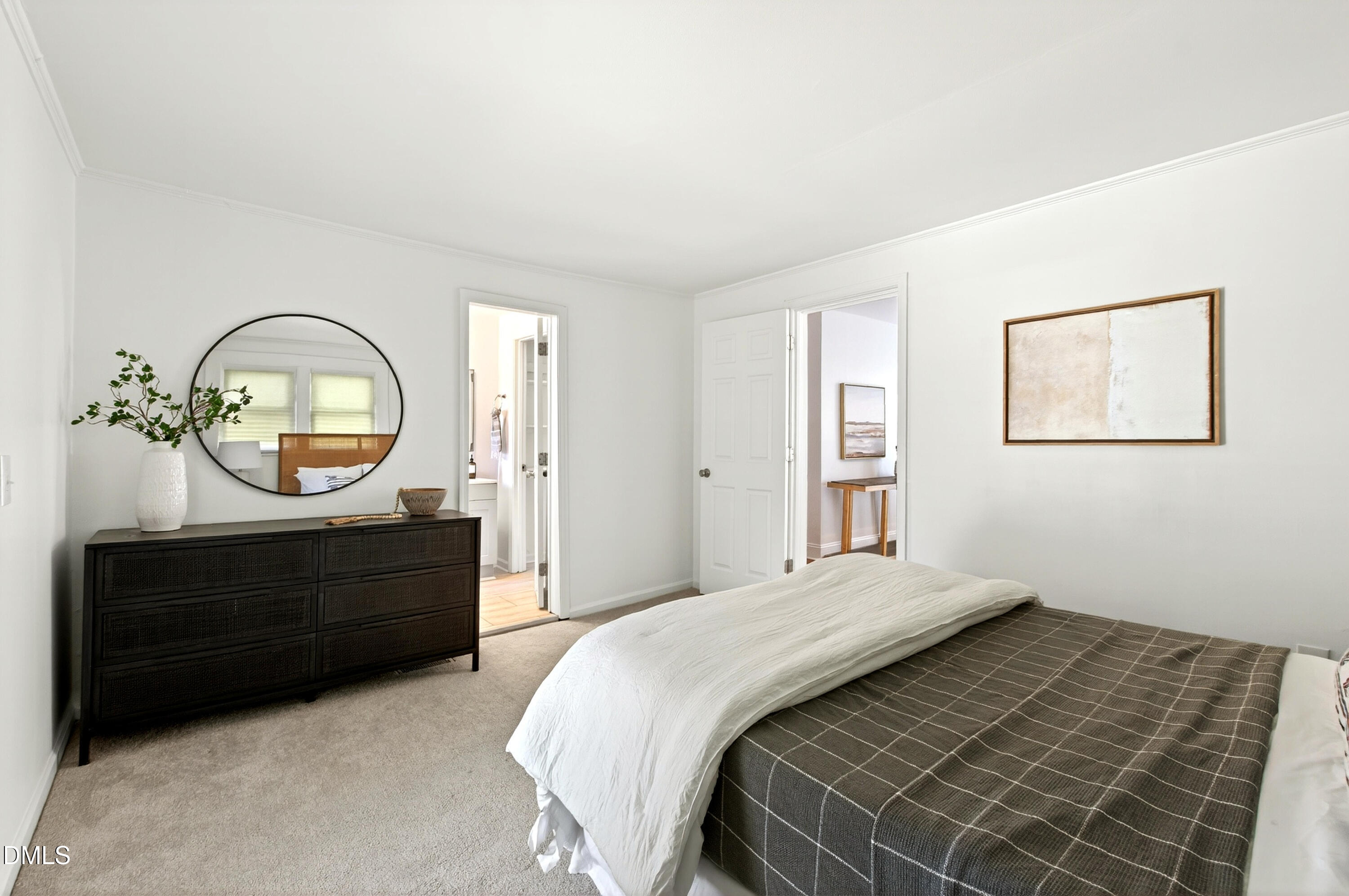 913 Washington Street Durham, NC 27701 - Photo 15 of 37 a bedroom with a bed and a mirror