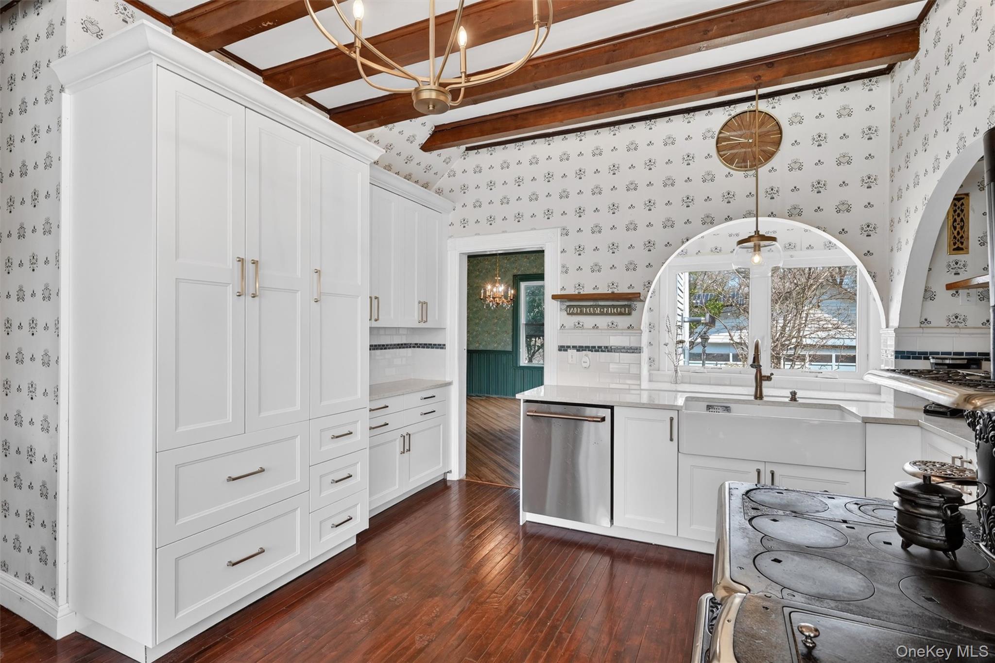 12 Perry Creek Road Washingtonville, NY 10992 - Photo 7 of 48 a kitchen with cabinets wooden floor and a fireplace