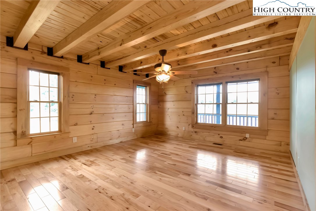 200 Nit Noi Row Boone, NC 28607 - Photo 19 of 45 a view of an empty room with wooden floor and a window