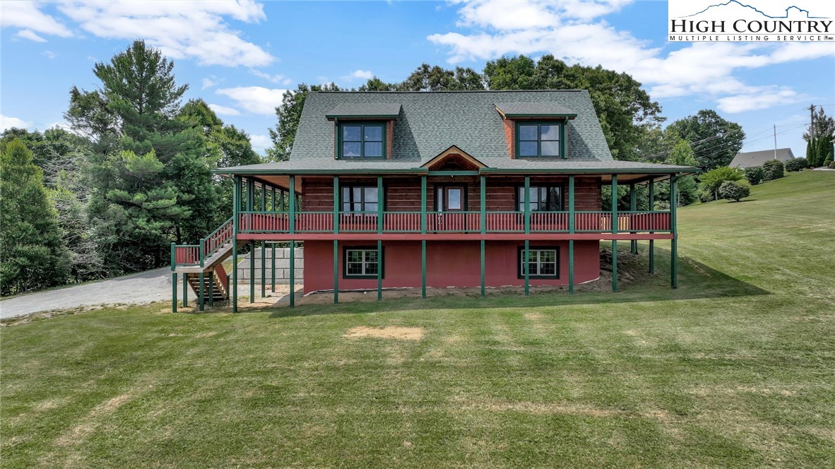 200 Nit Noi Row Boone, NC 28607 - Photo 2 of 45 a view of a house with pool and a yard