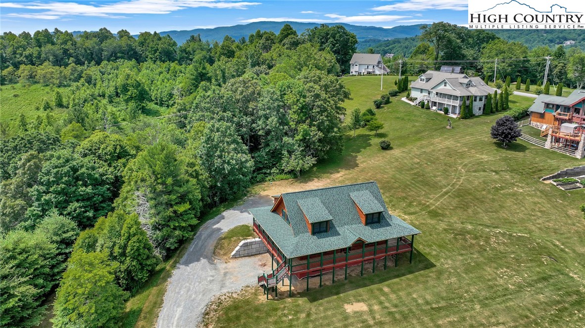 200 Nit Noi Row Boone, NC 28607 - Photo 42 of 45 a backyard of a house with a yard and outdoor seating