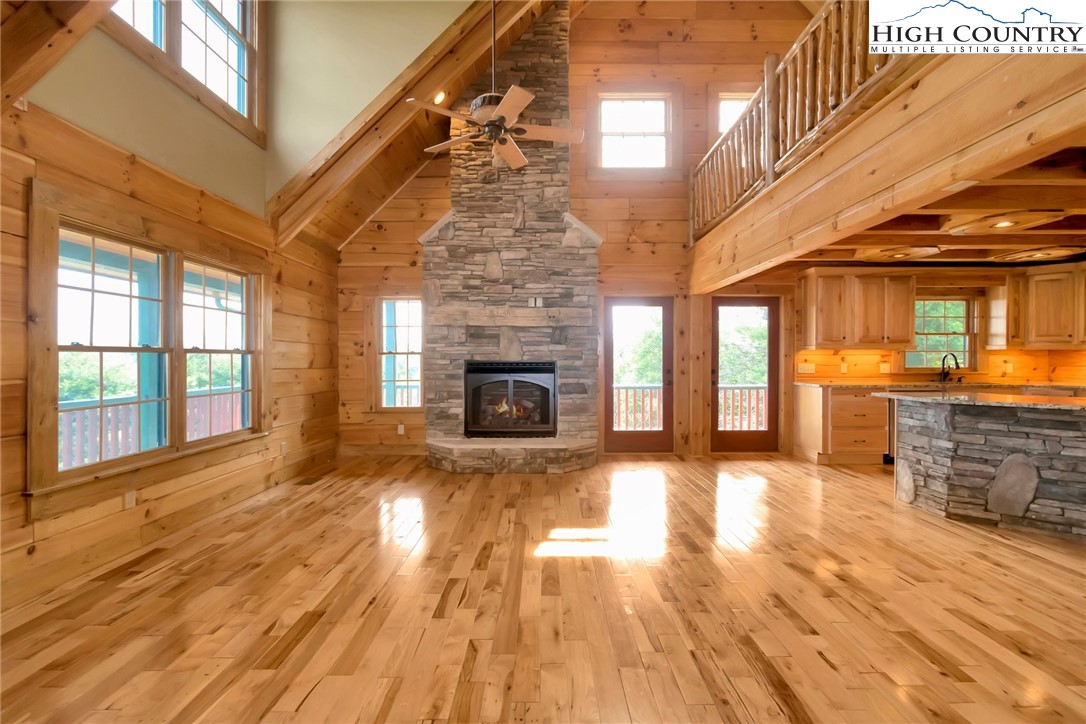 200 Nit Noi Row Boone, NC 28607 - Photo 7 of 45 a view of an empty room with wooden floor and a fireplace