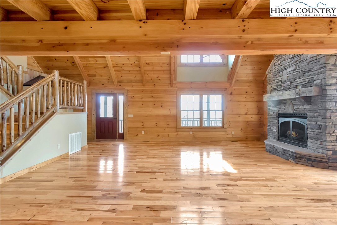 200 Nit Noi Row Boone, NC 28607 - Photo 8 of 45 a view of empty room with wooden floor and fireplace