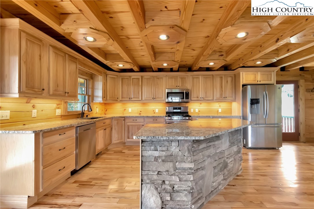 200 Nit Noi Row Boone, NC 28607 - Photo 10 of 45 a large kitchen with kitchen island lots of counter space a sink a window and appliances