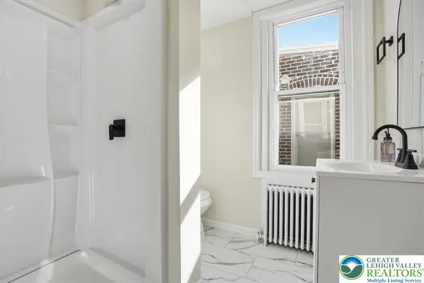 a view of a bedroom from a bathroom