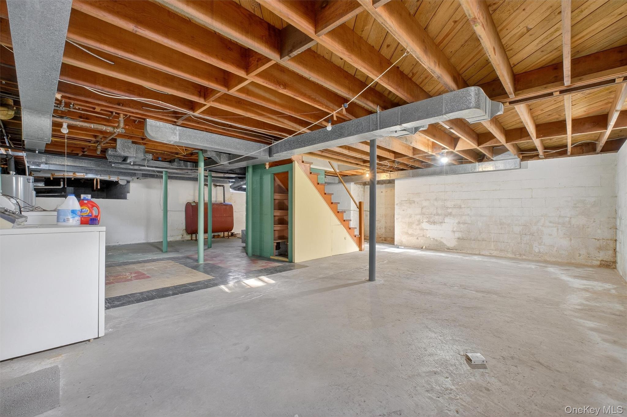 15 Valley View Road Hyde Park, NY 12538 - Photo 27 of 35 Unfinished basement with stairway, washer / clothes dryer, and heating fuel