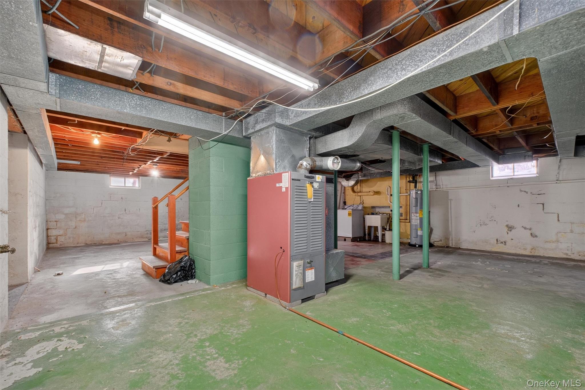 15 Valley View Road Hyde Park, NY 12538 - Photo 29 of 35 Below grade area featuring stairs, healthy amount of natural light, washer / dryer, and heating unit