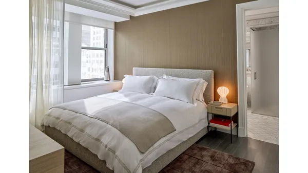 a kitchen with a sink and a mirror