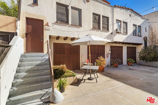 a view of a building with sitting area