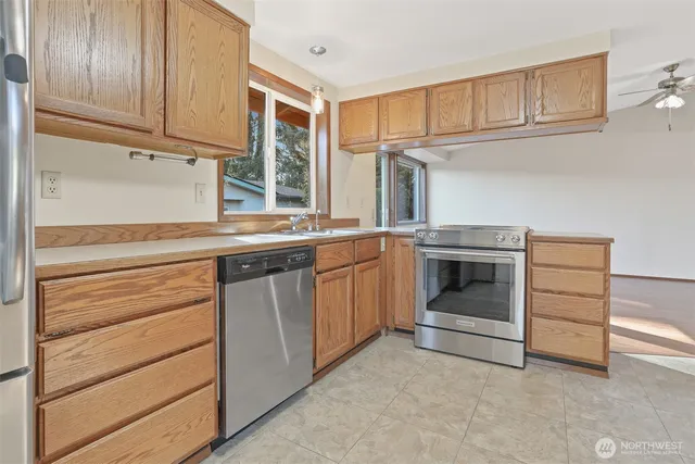 a kitchen with a stove oven and a sink