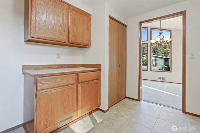 a view of cabinets and window in a room