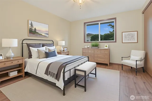 a spacious bedroom with a bed and a window