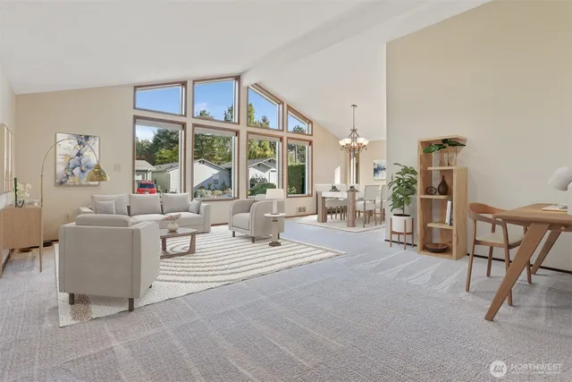 a living room with furniture a flat screen tv and a large window