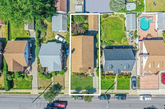 an aerial view of a house with a garden and plants