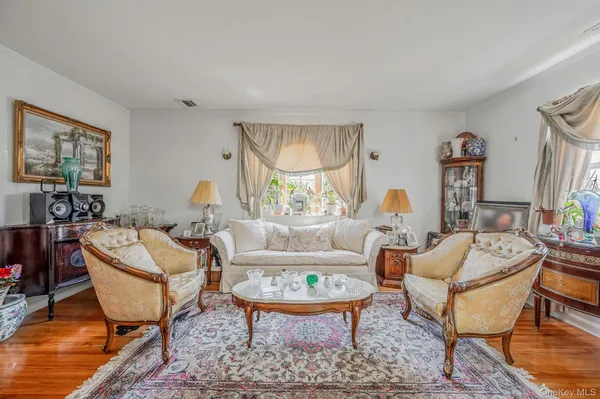 a living room with fireplace furniture and a table