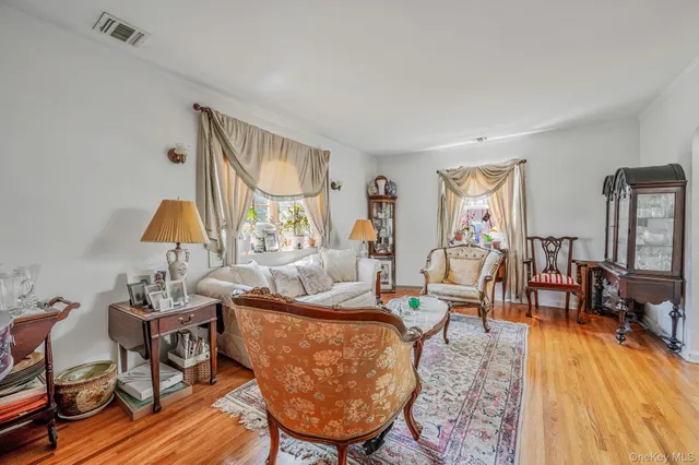 a living room with furniture and a lamp