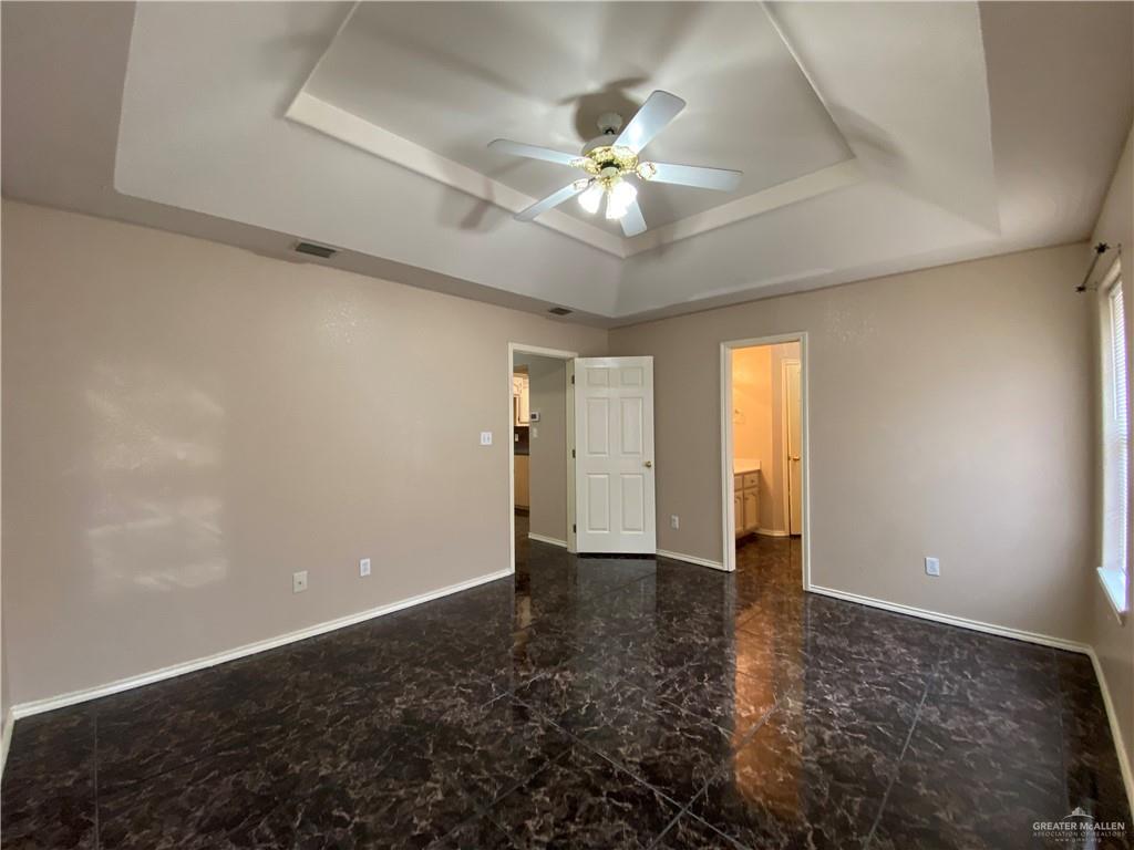 2207 Paseo Encantado Mission, TX 78572 - Photo 11 of 44 a view of an empty room with a chandelier fan