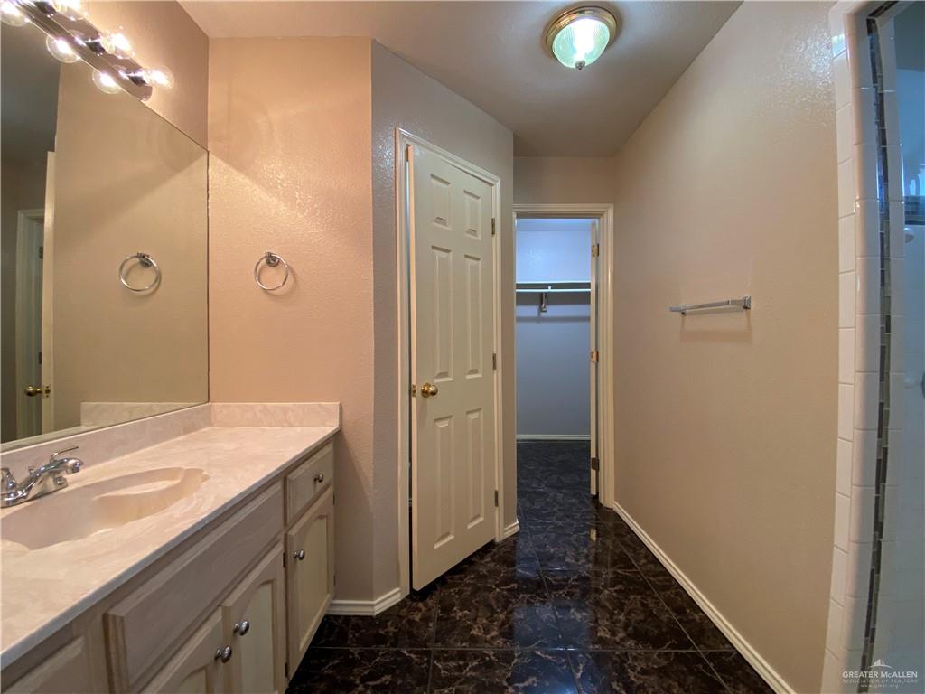 2207 Paseo Encantado Mission, TX 78572 - Photo 12 of 44 a bathroom with a sink and a mirror