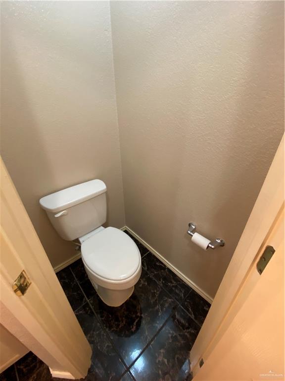 2207 Paseo Encantado Mission, TX 78572 - Photo 14 of 44 a bathroom with a toilet and a sink