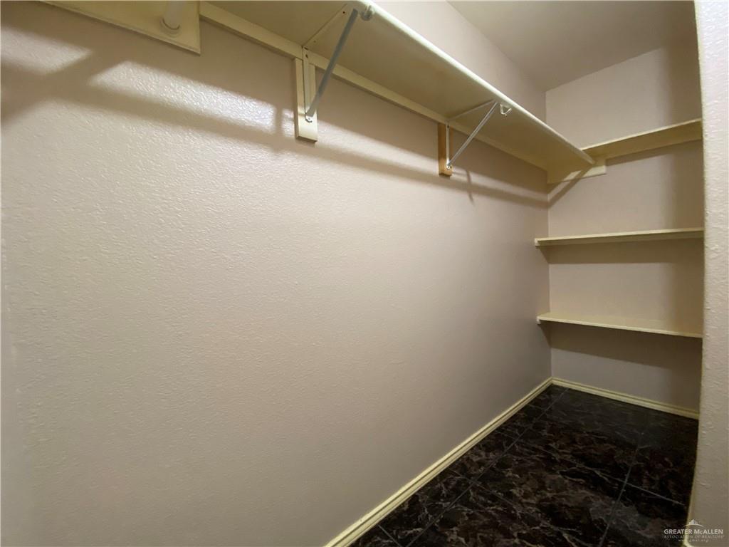 2207 Paseo Encantado Mission, TX 78572 - Photo 15 of 44 a view of a room with racks on the wall