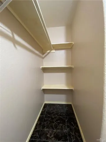 a kitchen with stainless steel appliances granite countertop a sink a stove and cabinets