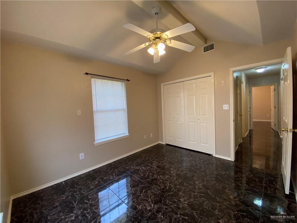 2207 Paseo Encantado Mission, TX 78572 - Photo 27 of 44 a view of an empty room with wooden floor and a ceiling fan