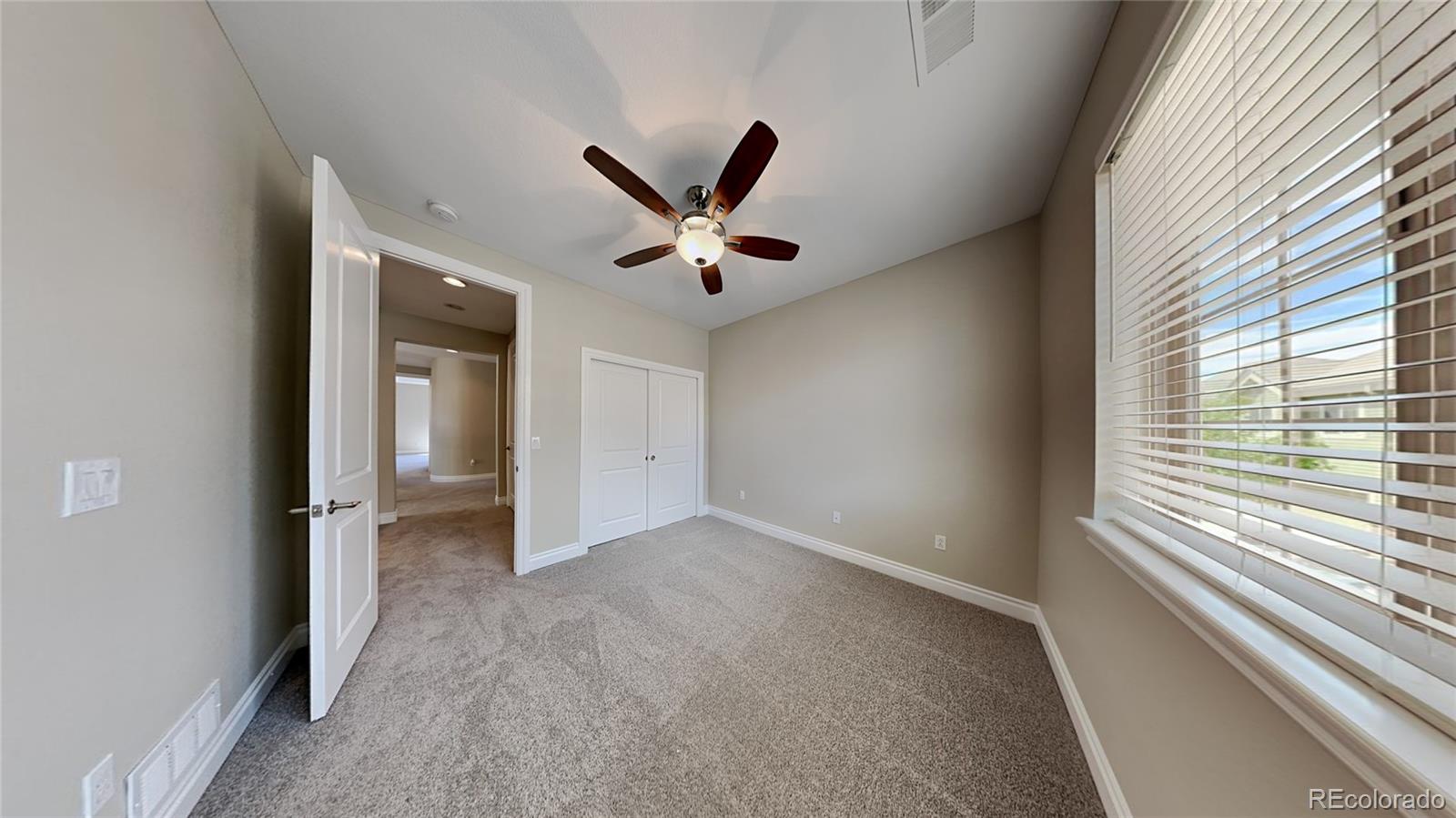 9237 Mornington Way Lone Tree, CO 80124 - Photo 18 of 24 an empty room that has a window