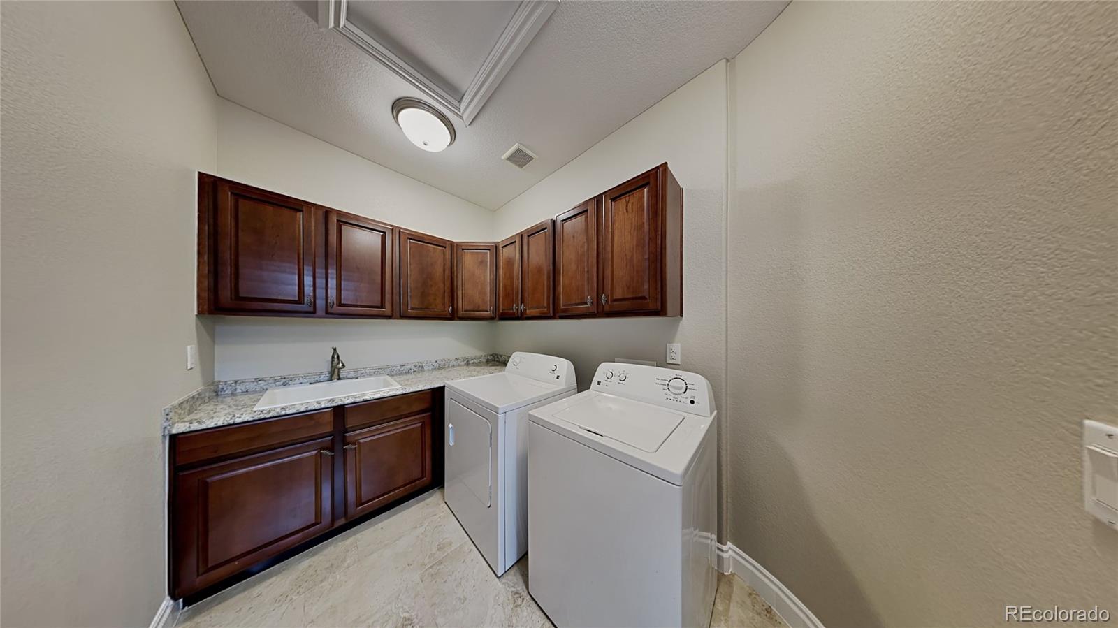 9237 Mornington Way Lone Tree, CO 80124 - Photo 10 of 24 a utility room with dryer and washer
