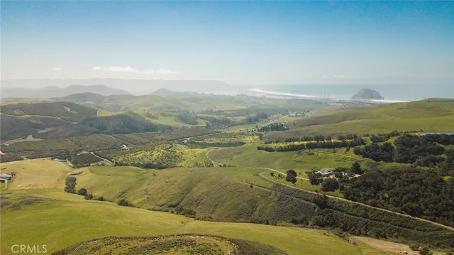 a view of an ocean and mountains