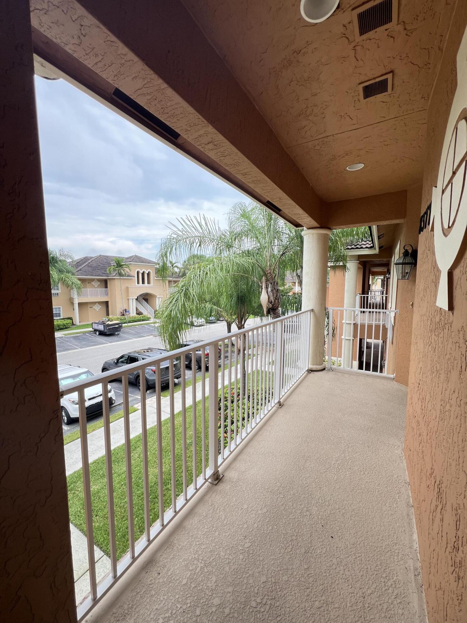 8377 Mulligan Circle, Unit SIDE B Port St. Lucie, FL 34986 - Photo 7 of 17 a view of balcony with furniture