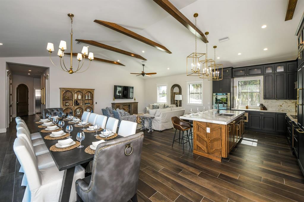 340 Jackson Drive Sarasota, FL 34236 - Photo 13 of 100 a large kitchen with a counter space a sink appliances and living room view