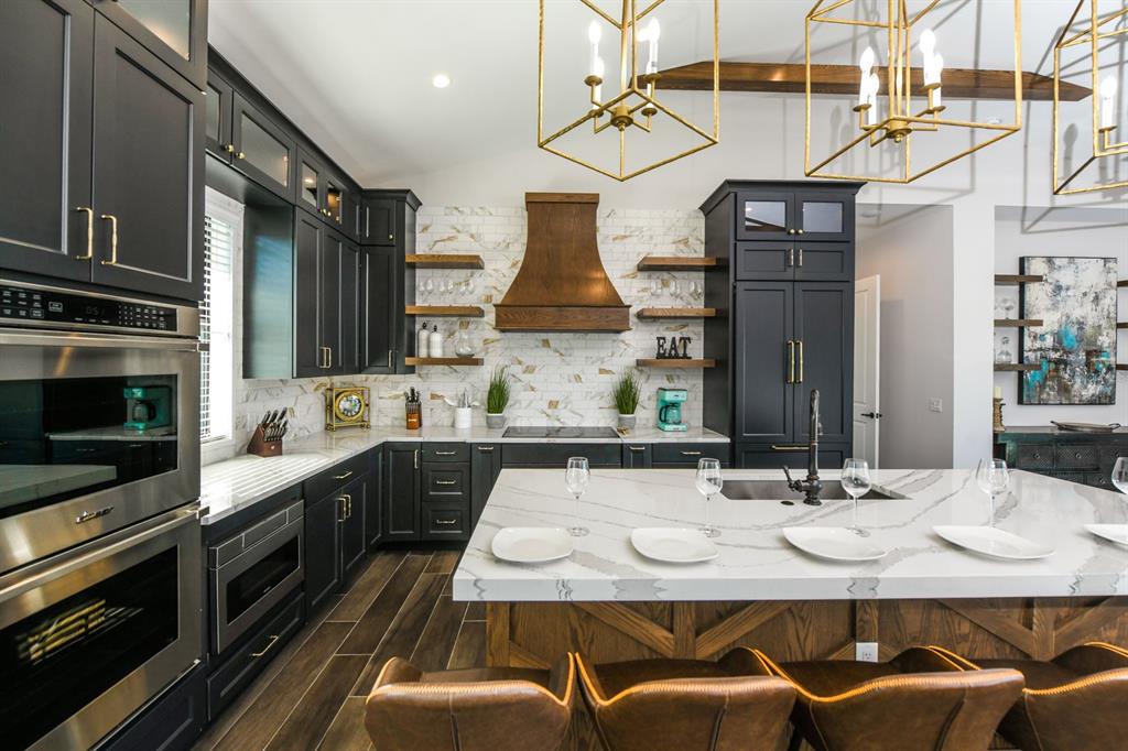 340 Jackson Drive Sarasota, FL 34236 - Photo 16 of 100 a kitchen with stainless steel appliances kitchen island granite countertop a sink and cabinets