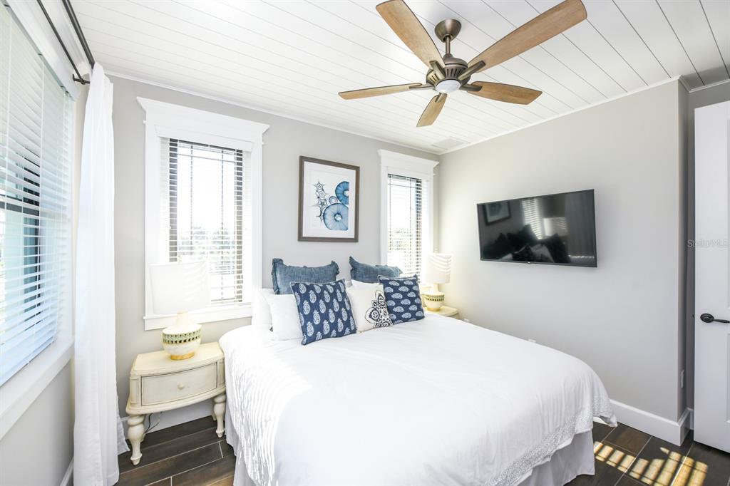 340 Jackson Drive Sarasota, FL 34236 - Photo 32 of 100 a bedroom with a bed and a chandelier