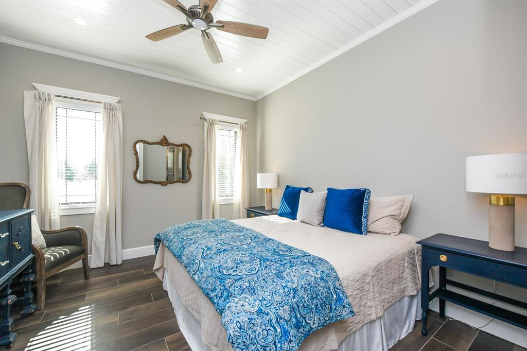 340 Jackson Drive Sarasota, FL 34236 - Photo 45 of 100 a bedroom with a bed and wooden floor