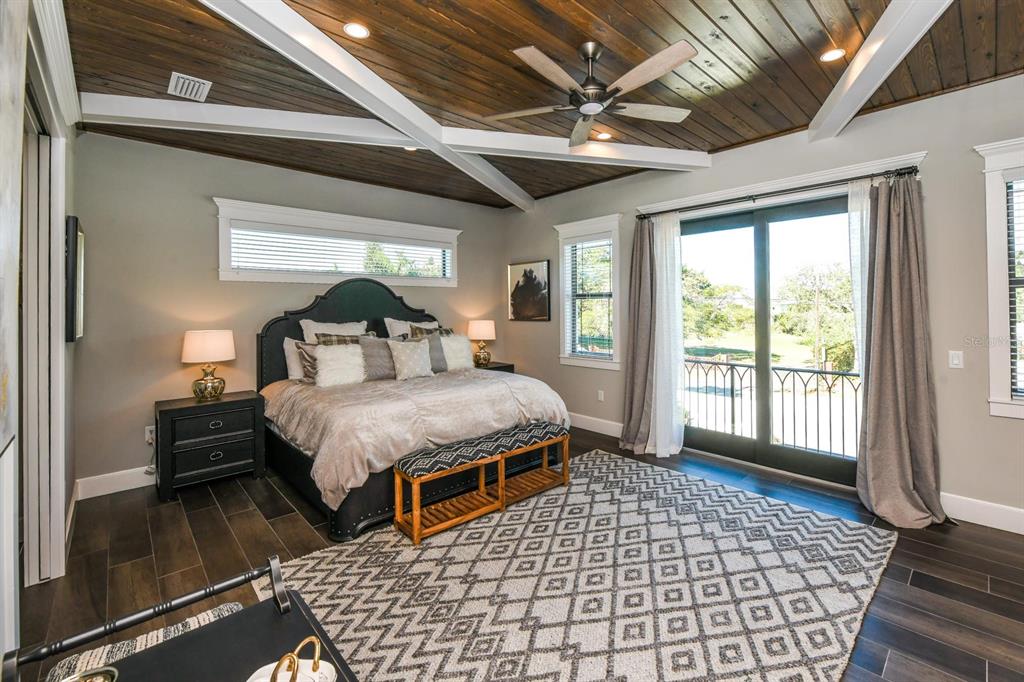 340 Jackson Drive Sarasota, FL 34236 - Photo 51 of 100 a spacious bedroom with a bed and a large window