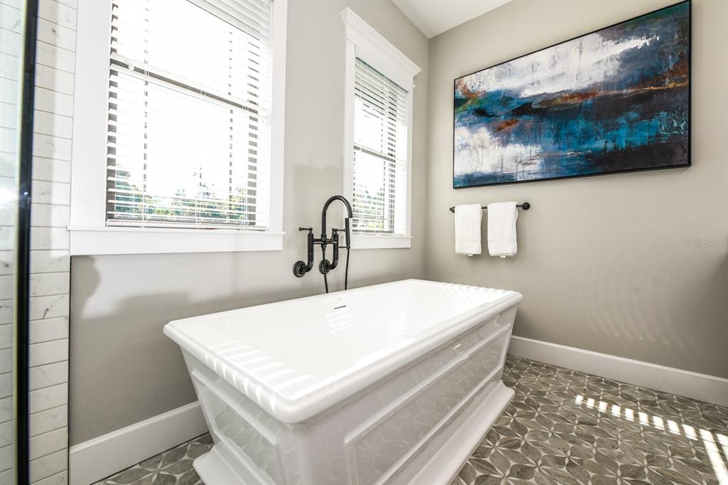 340 Jackson Drive Sarasota, FL 34236 - Photo 59 of 100 a white bed sitting in a bathroom next to a window