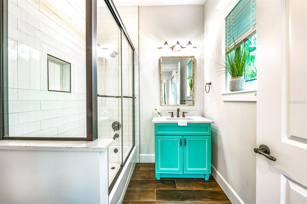 340 Jackson Drive Sarasota, FL 34236 - Photo 62 of 100 a bathroom with a sink and a mirror