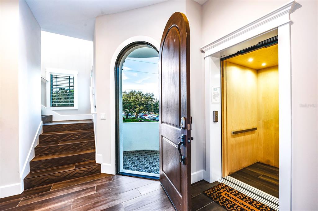 340 Jackson Drive Sarasota, FL 34236 - Photo 8 of 100 a view of an entryway with wooden floor and a livingroom