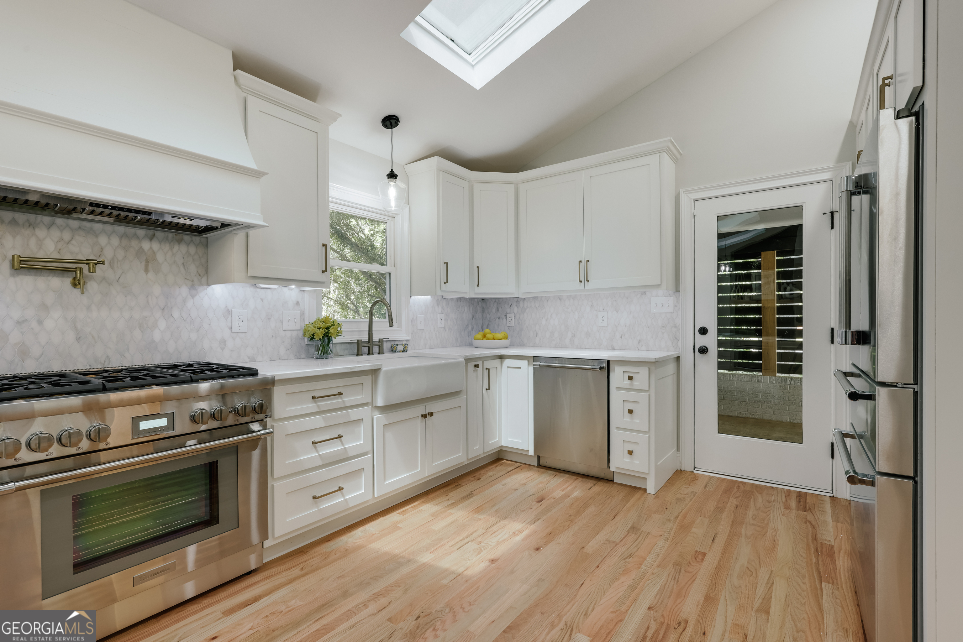 290 Fortson Drive Athens, GA 30606 - Photo 11 of 61 a kitchen with granite countertop a stove and a sink