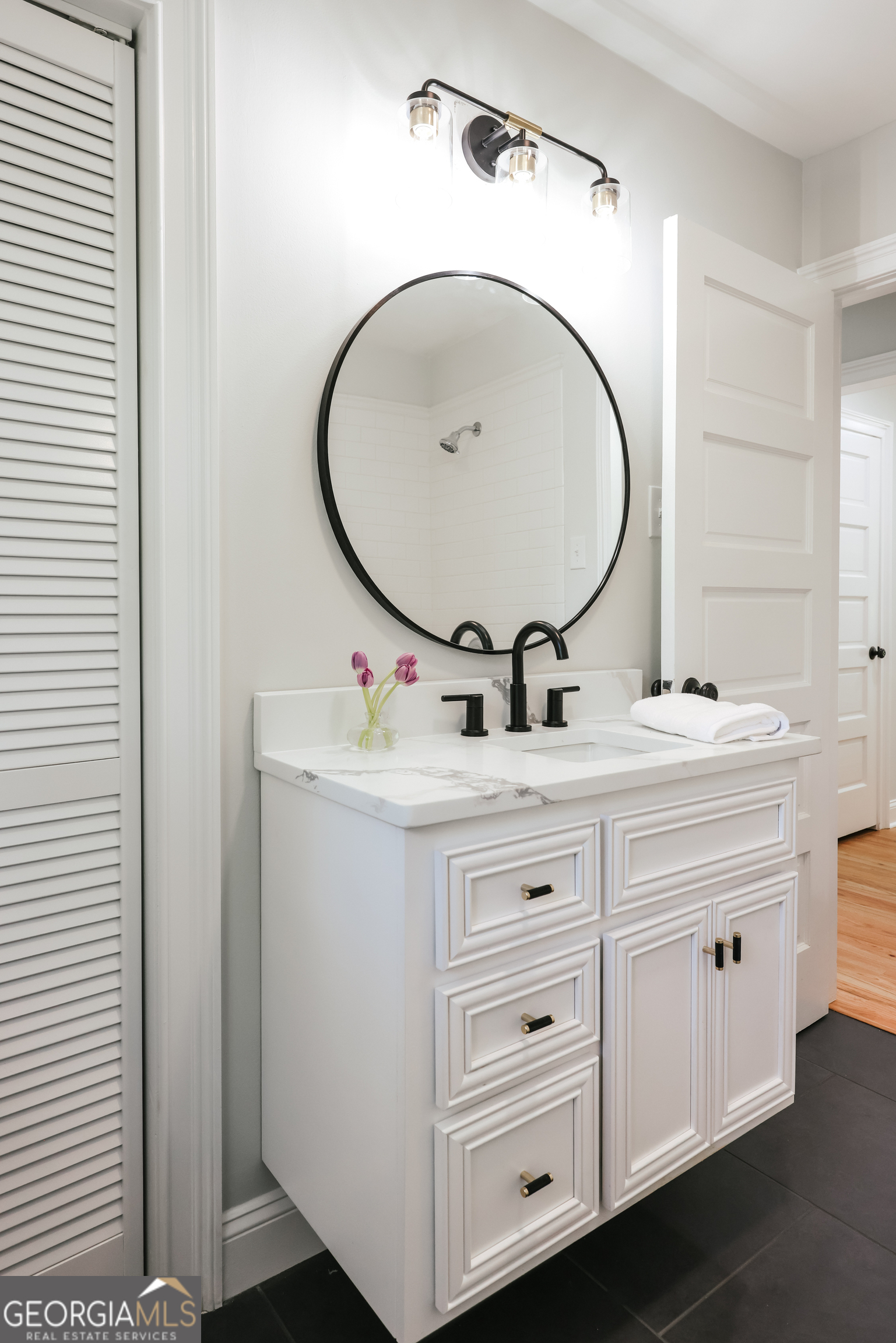 290 Fortson Drive Athens, GA 30606 - Photo 22 of 61 a bathroom with a sink and a mirror